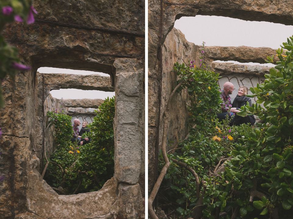 couple sitting in a secret garden at the sutro bath ruins in california